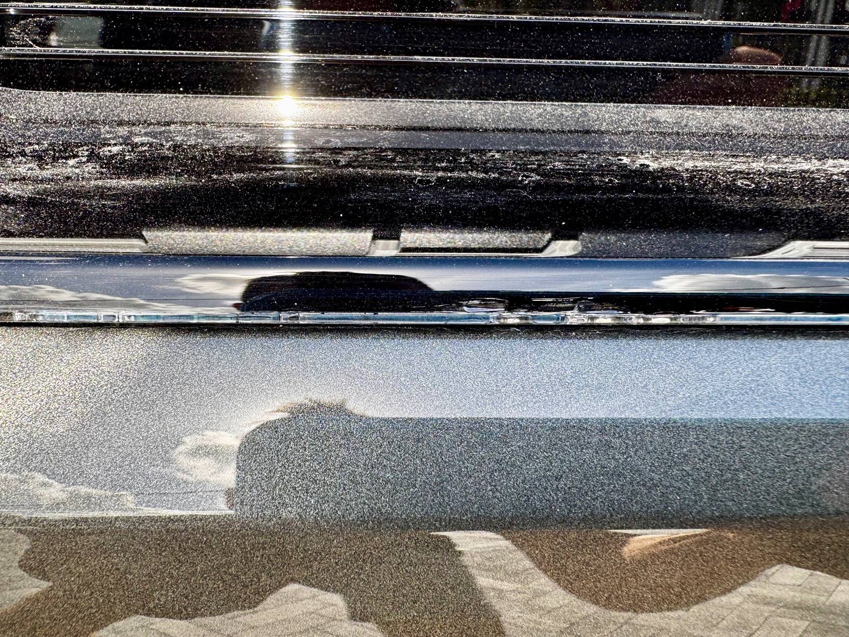 Electric Macan EV Cracks on black glass trunk trim IMG_5725