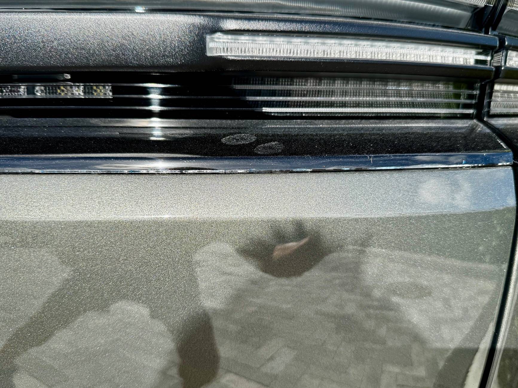 Electric Macan EV Cracks on black glass trunk trim IMG_5723