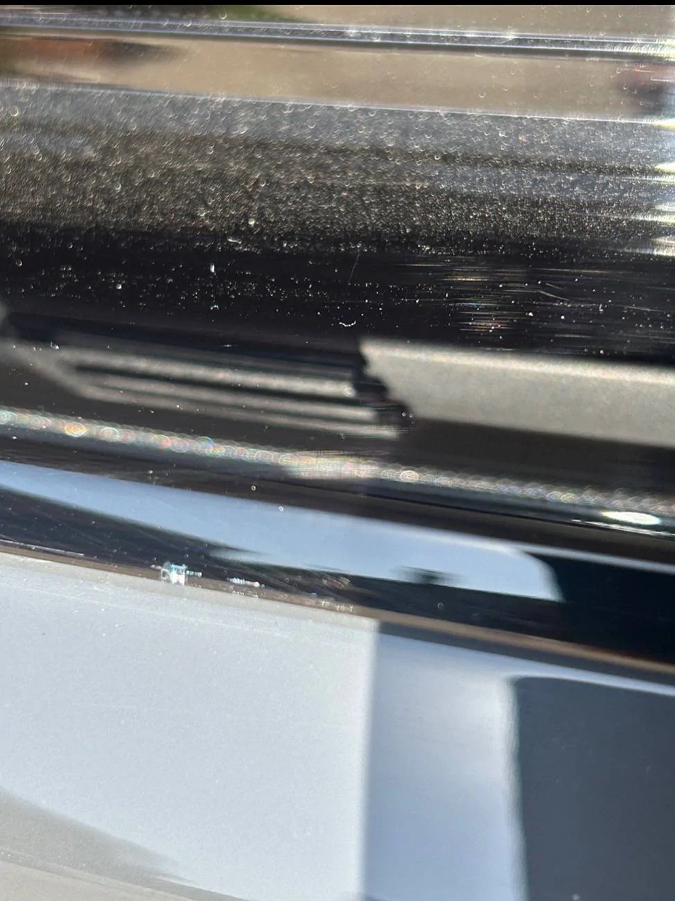 Electric Macan EV Cracks on black glass trunk trim IMG_7157
