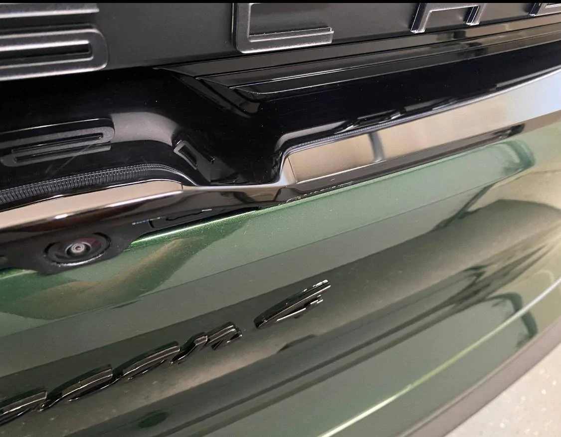 Electric Macan EV Cracks on black glass trunk trim IMG_7156