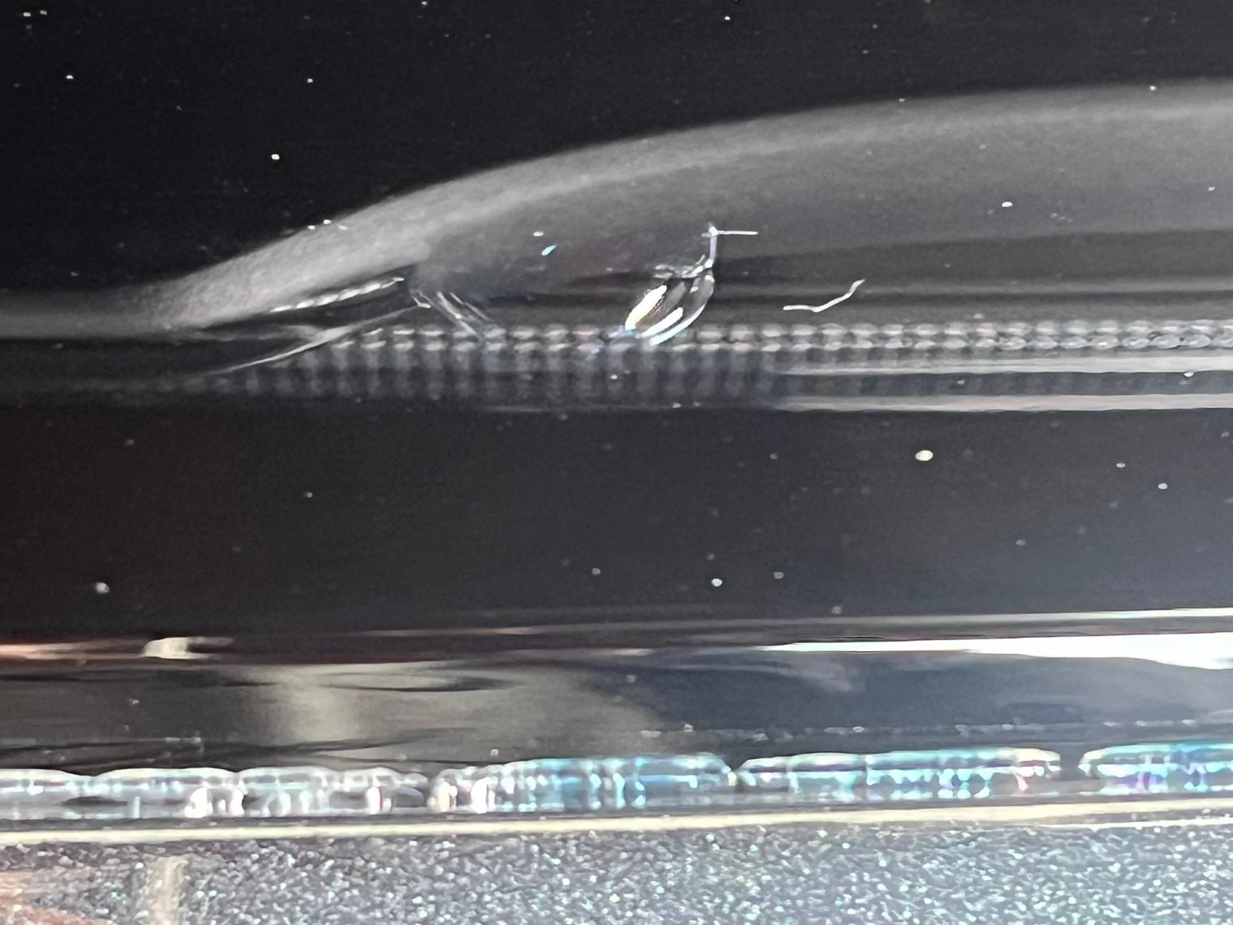 Electric Macan EV Cracks on black glass trunk trim IMG_0223