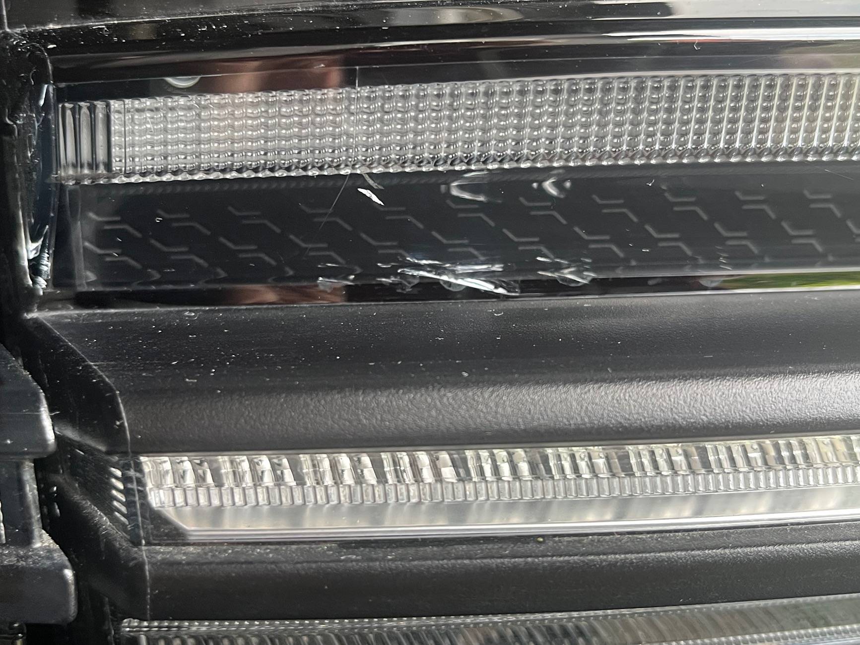 Electric Macan EV Cracks on black glass trunk trim IMG_0220