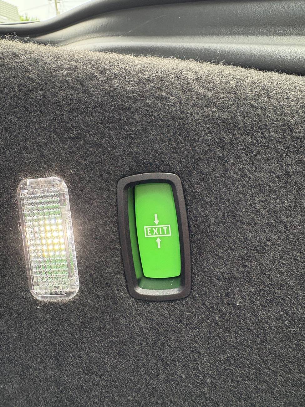 Electric Macan EV “Exit” button in front storage area IMG_1655