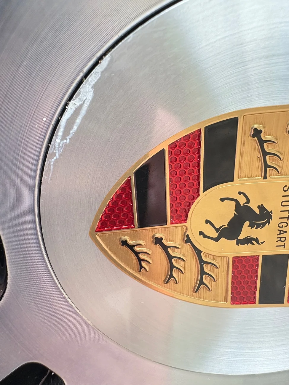 Electric Macan EV Center cap scratches IMG_0577