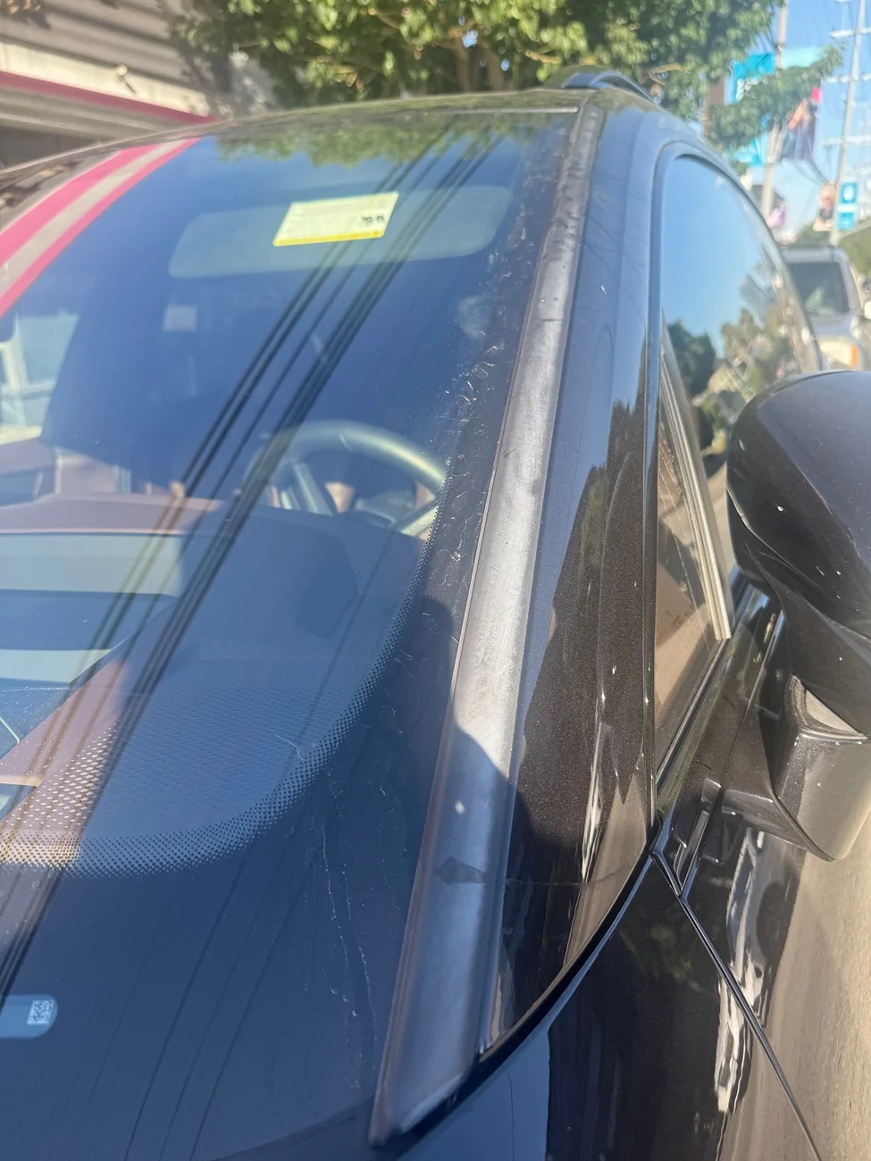 Electric Macan EV Front windshield weatherstripping - discolored and deteriorating IMG_3952