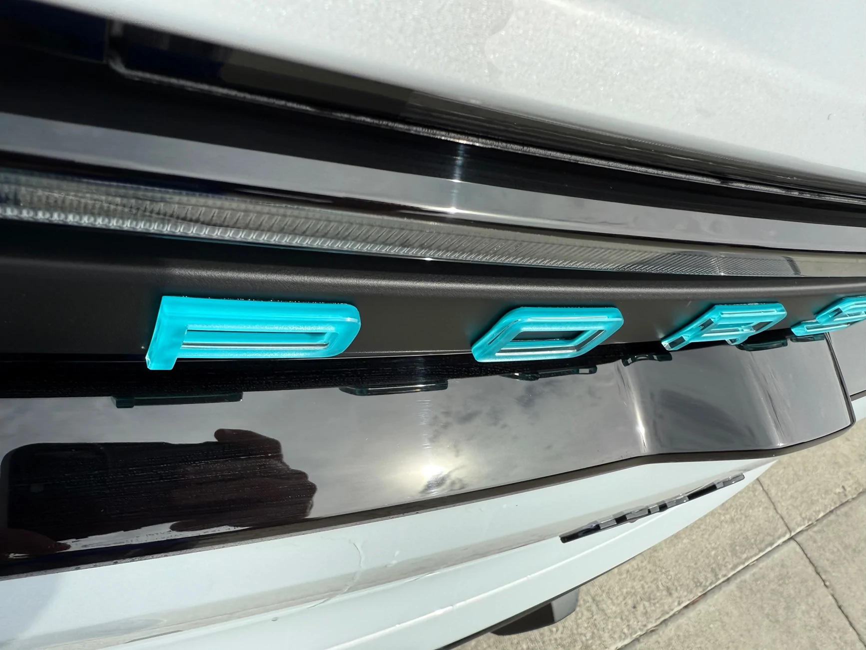 Electric Macan EV Change rear "PORSCHE" lettering to black from Glacier Blue IMG_5023
