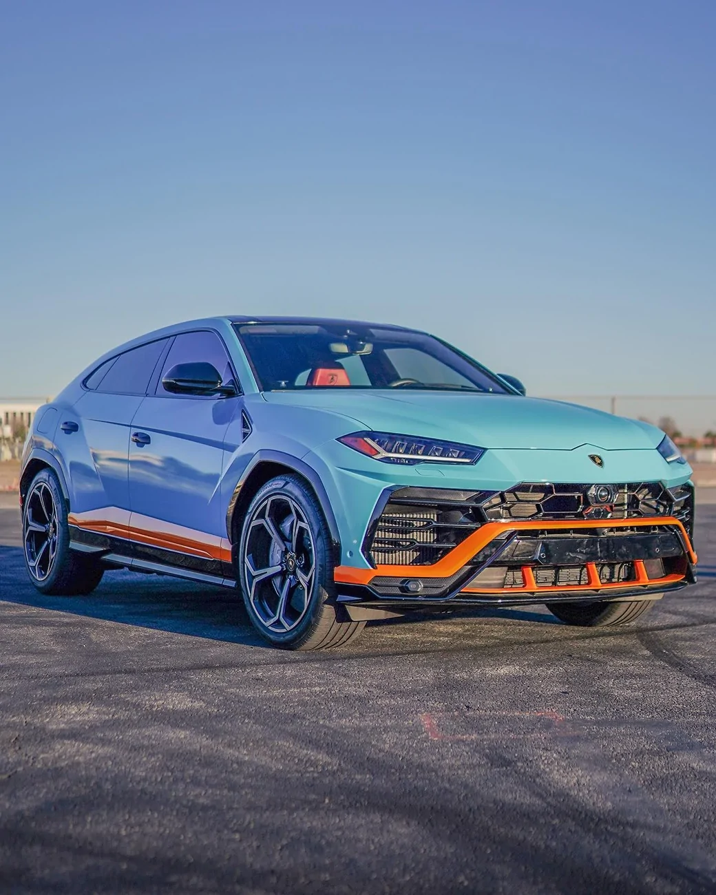 Electric Macan EV Orange accents on Frozen Blue Macan EV 129749778_3776839825700093_8547519569684718016_n