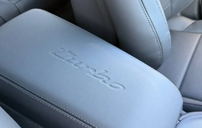 Photos: model logo on center armrest and race-tex center console frame